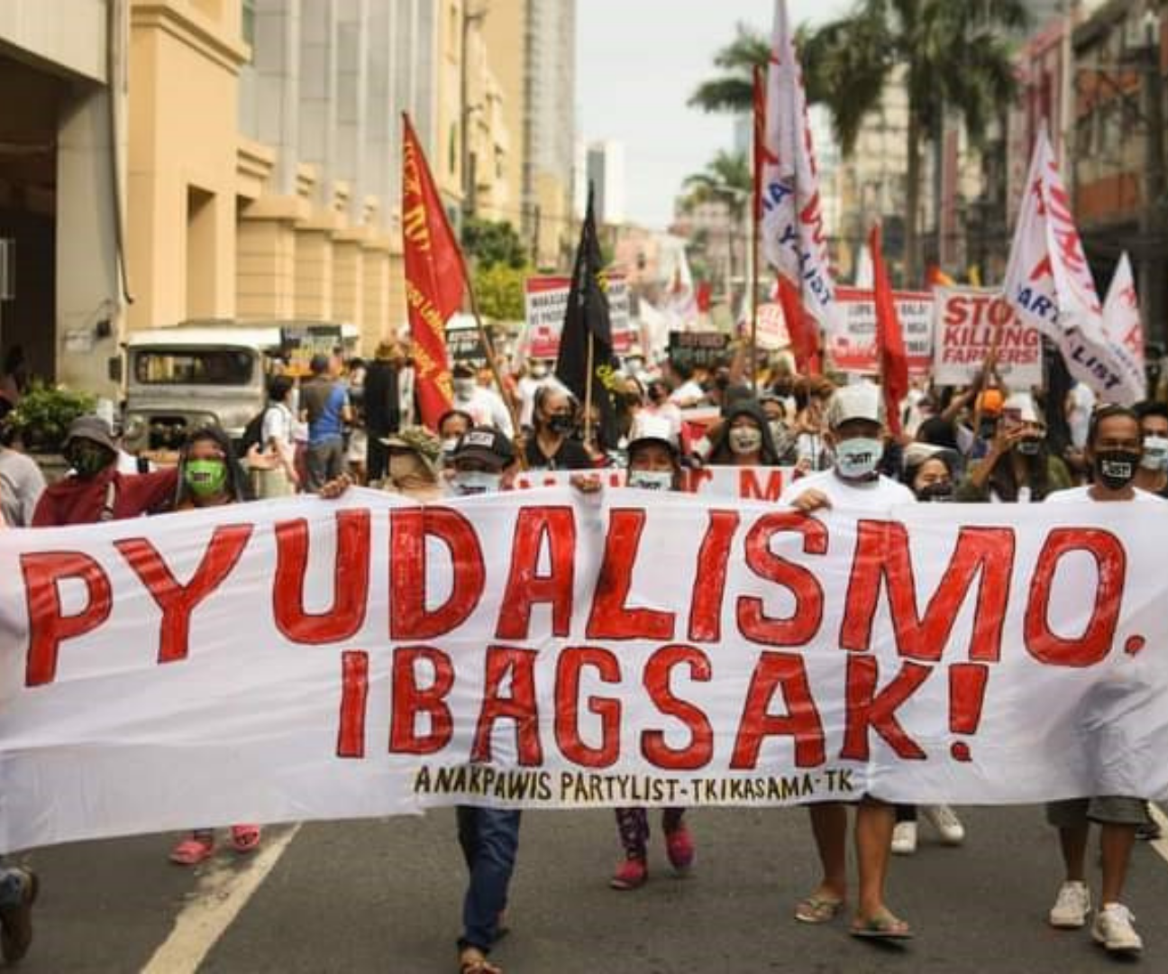 Agricultural organizations holding a poster saying 'Pyudalismo ibagsak!' at a protest. (Bulatlat, 2021)